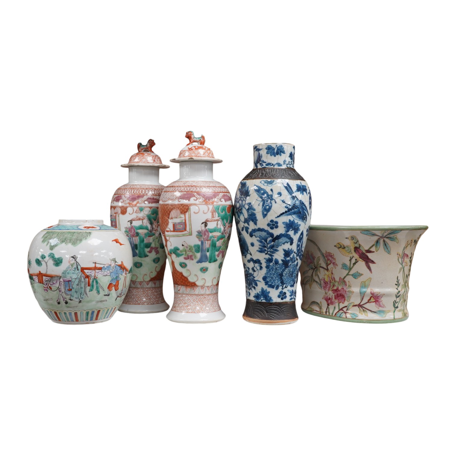 A group of Chinese ceramics to include a pair of early 20th century famille rose vases and covers, a 19th century blue and white crackle glazed vase etc, largest 31cm high. Condition - mostly fair, a few chips and cracks